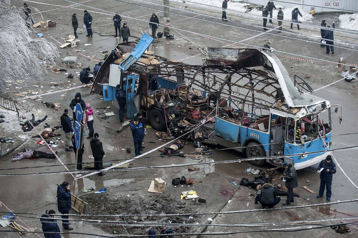 Investigators work at the site of a blast on a trolleybus in Volgograd