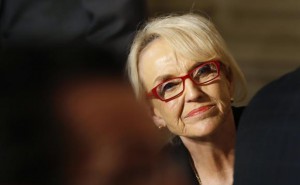 Arizona Governor Brewer looks up as U.S. President Barack Obama addresses the National Governors Association in the State Dining Room of the White House in Washington